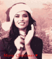 戴圣诞帽的爱笑女孩摇铃铛gif动态图片